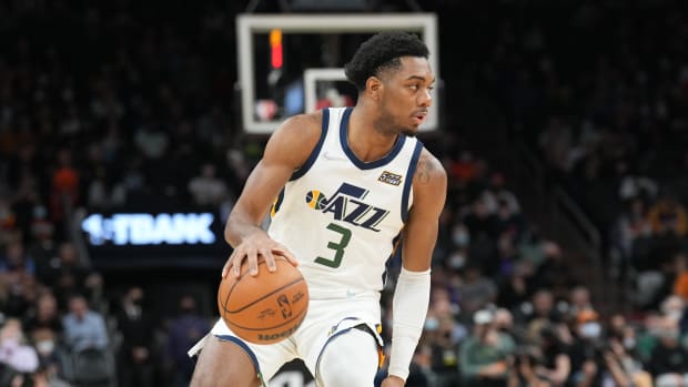 Utah Jazz guard Trent Forrest dribbles the ball.
